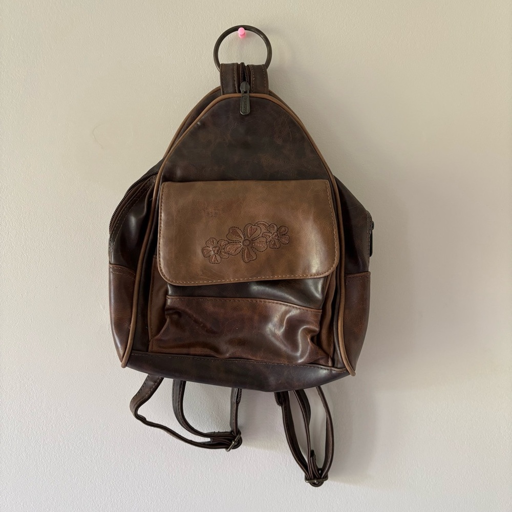Elegant Brown Leather Backpack with Floral Accent